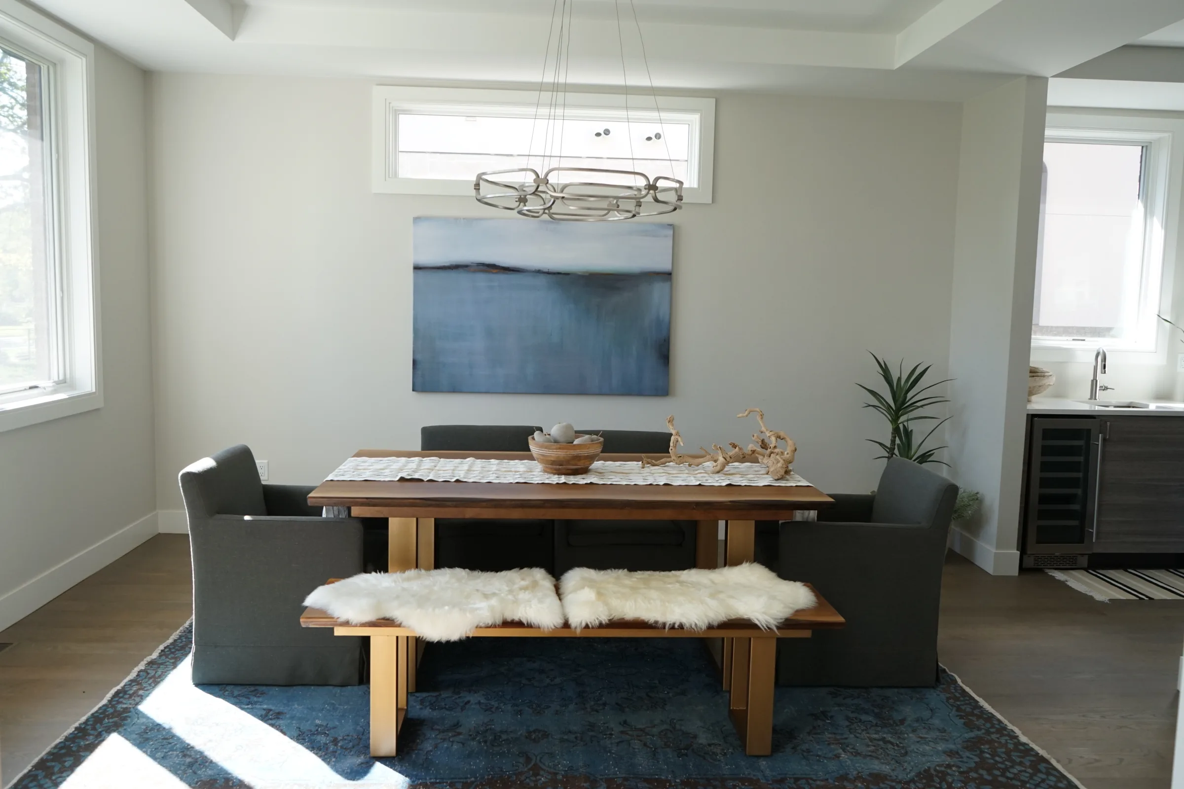 Finished dining room with bench seating, artwork and fresh paint
