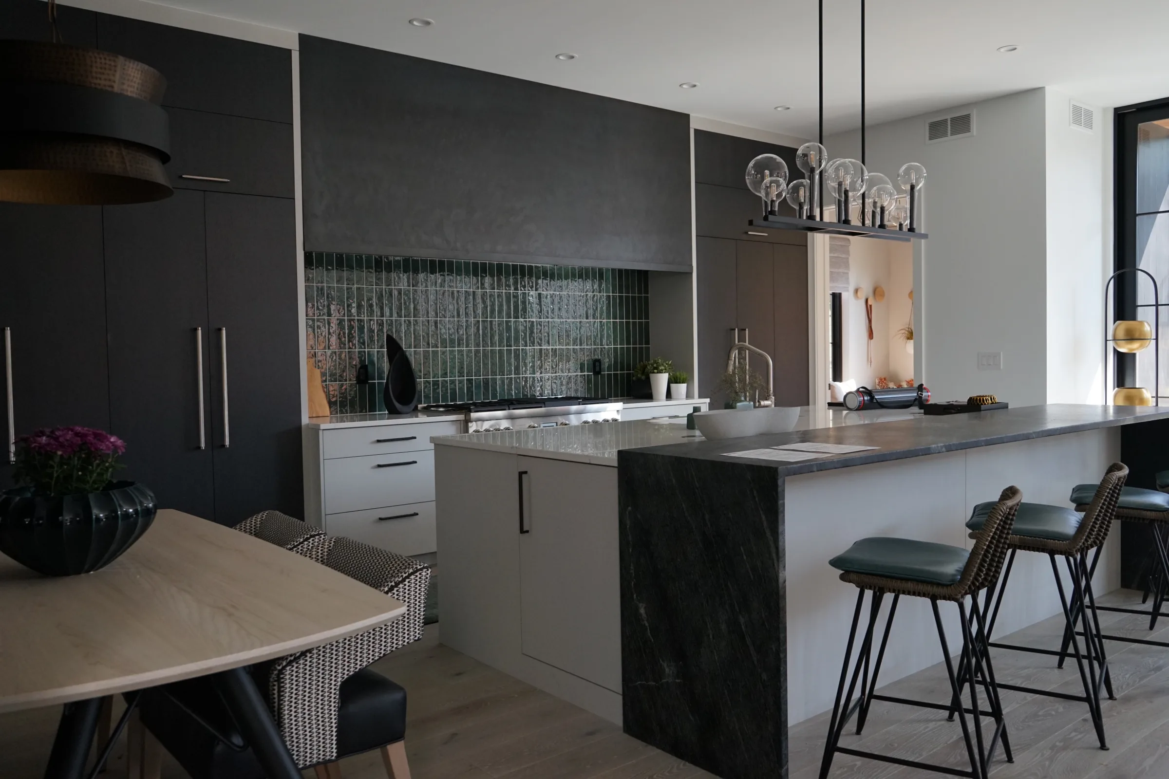 Dark modern kitchen with an island and bar seating