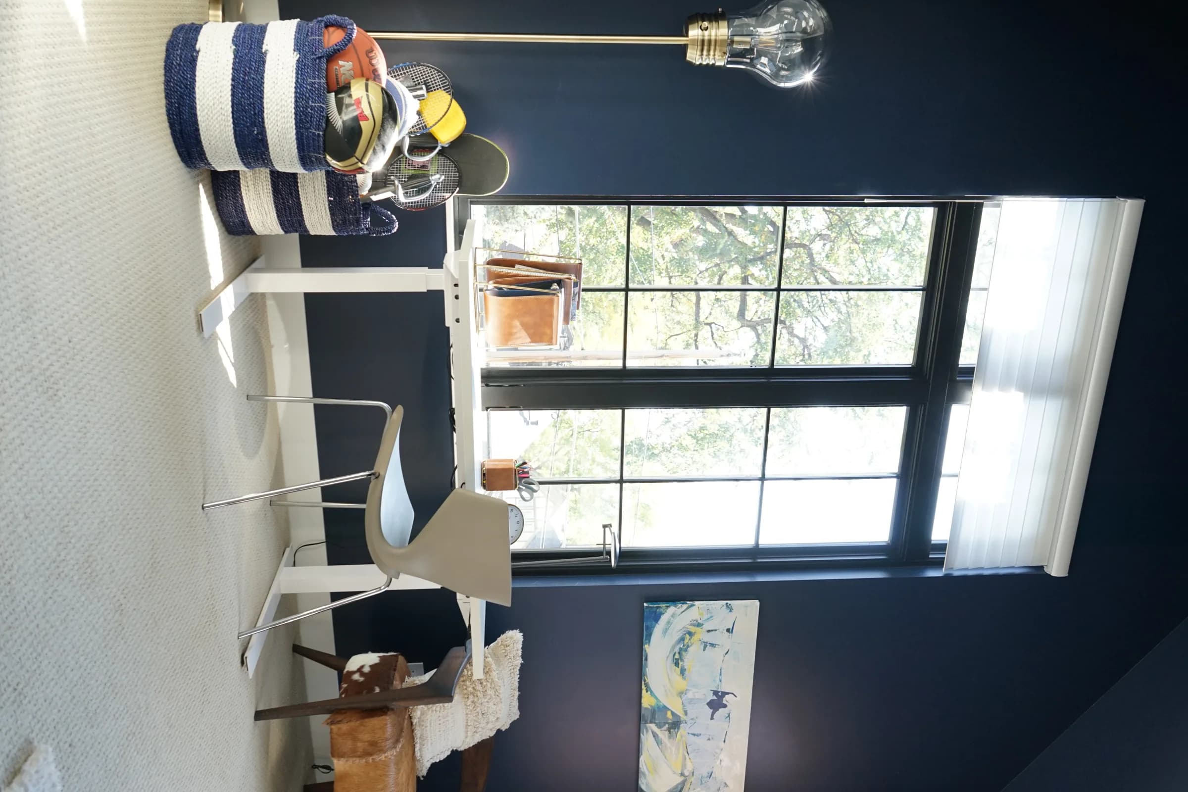 Kids' bunk room with a navy accent wall